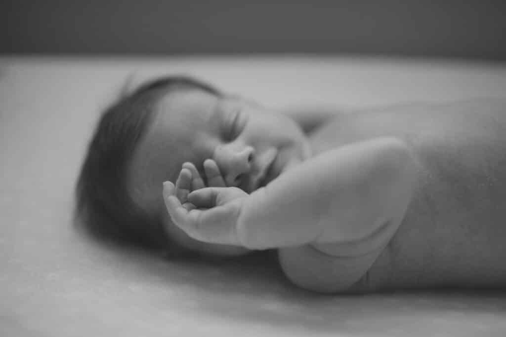 Black and white photo of newborn