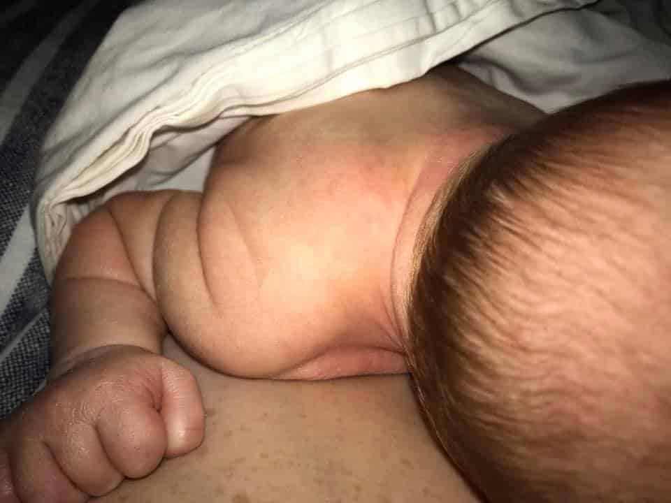 Hypno-mom laura's newborn laying skin to skin - close up.