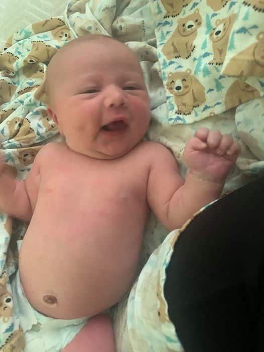 Newborn baby smiling
