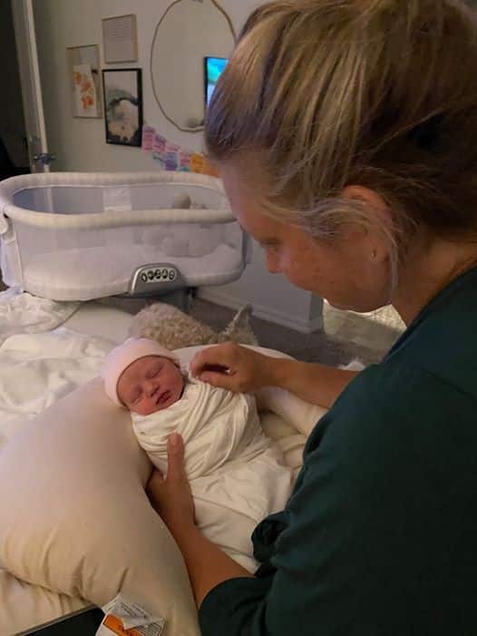 Hypno-mom looking down at newborn baby