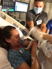 Hypno-mom being handed her newborn baby