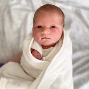 Newborn Baby wrapped in white blanket