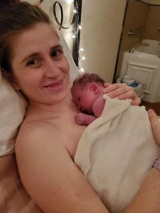 New parent skin to skin with newborn baby