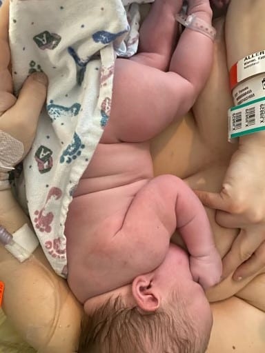 Newborn baby skin to skin and feeding