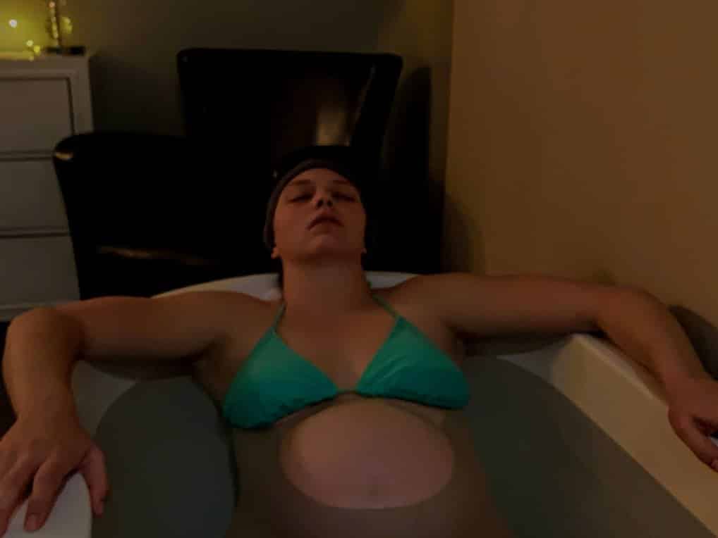 Pregnant person in tub