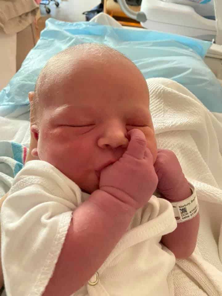 Newborn baby sucking thumb