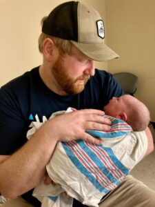 New parent holding newborn baby