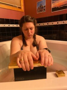 Birthing person in tub