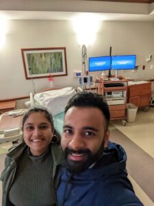 Pregnant couple in hospital room before birth