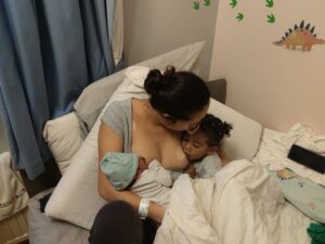 New Hypnobabies parent nursing both toddler and newborn baby