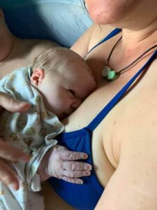 New parent holding newborn skin to skin