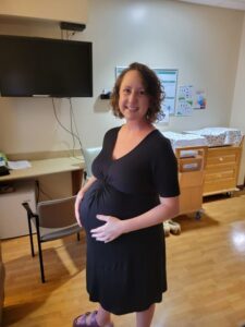 pregnant person smiling and preparing forPositive, Easy Induction without Epidural