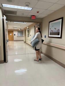 Hypnobabies student holding pillow in hospital hallway